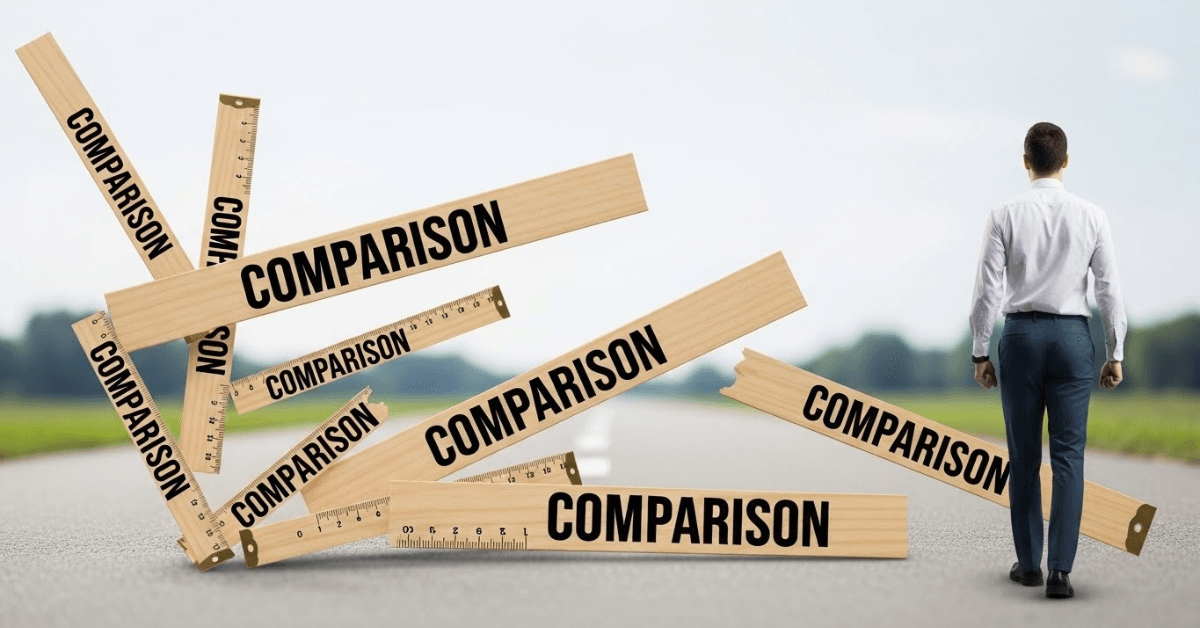 A person walking forward on an open road as wooden measuring sticks labeled “comparison” fall behind them, symbolizing the release of comparison and a renewed focus on personal progress.