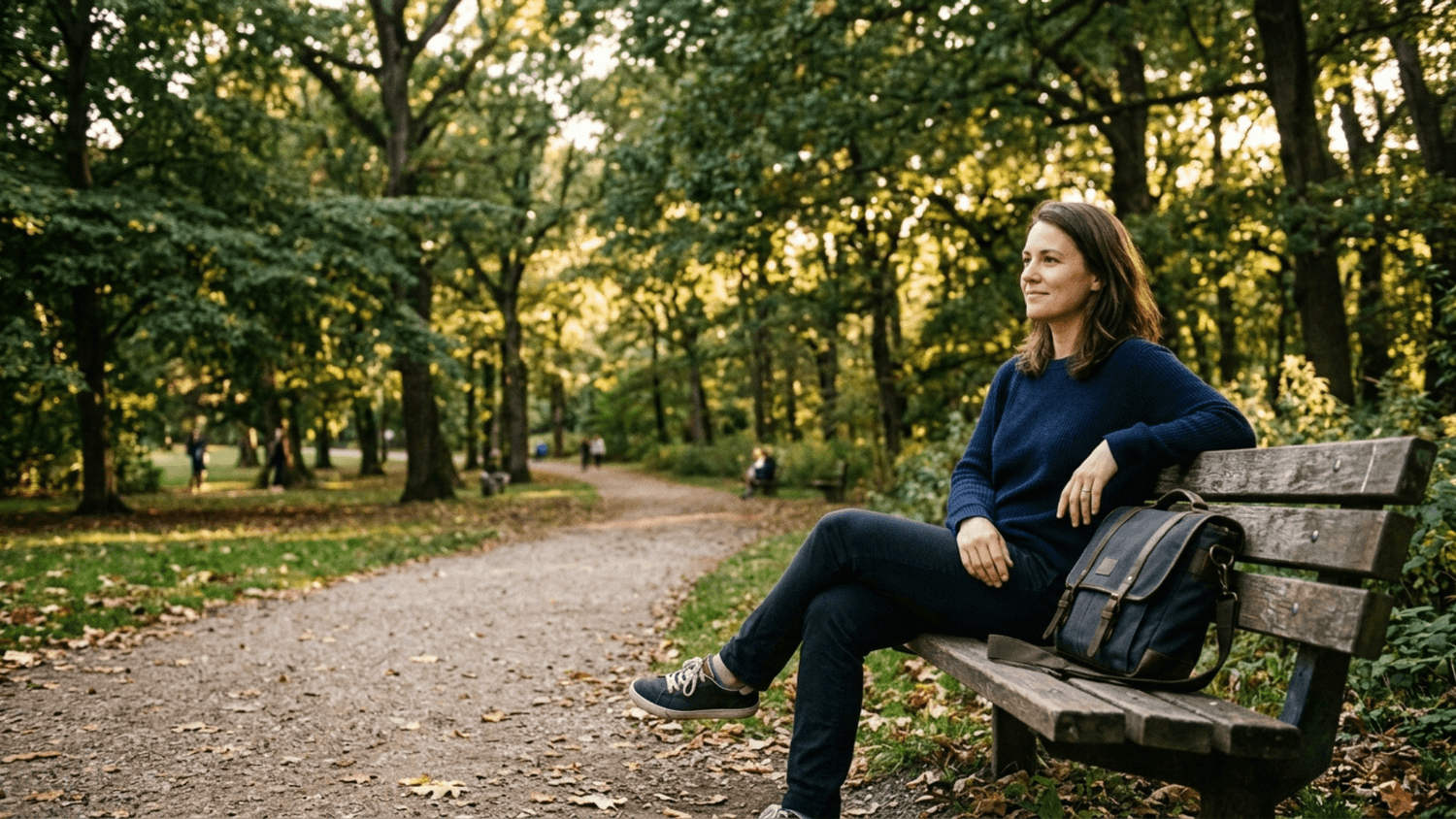Adult relaxing on a neighborhood park bench during a quiet decompression break after work.
