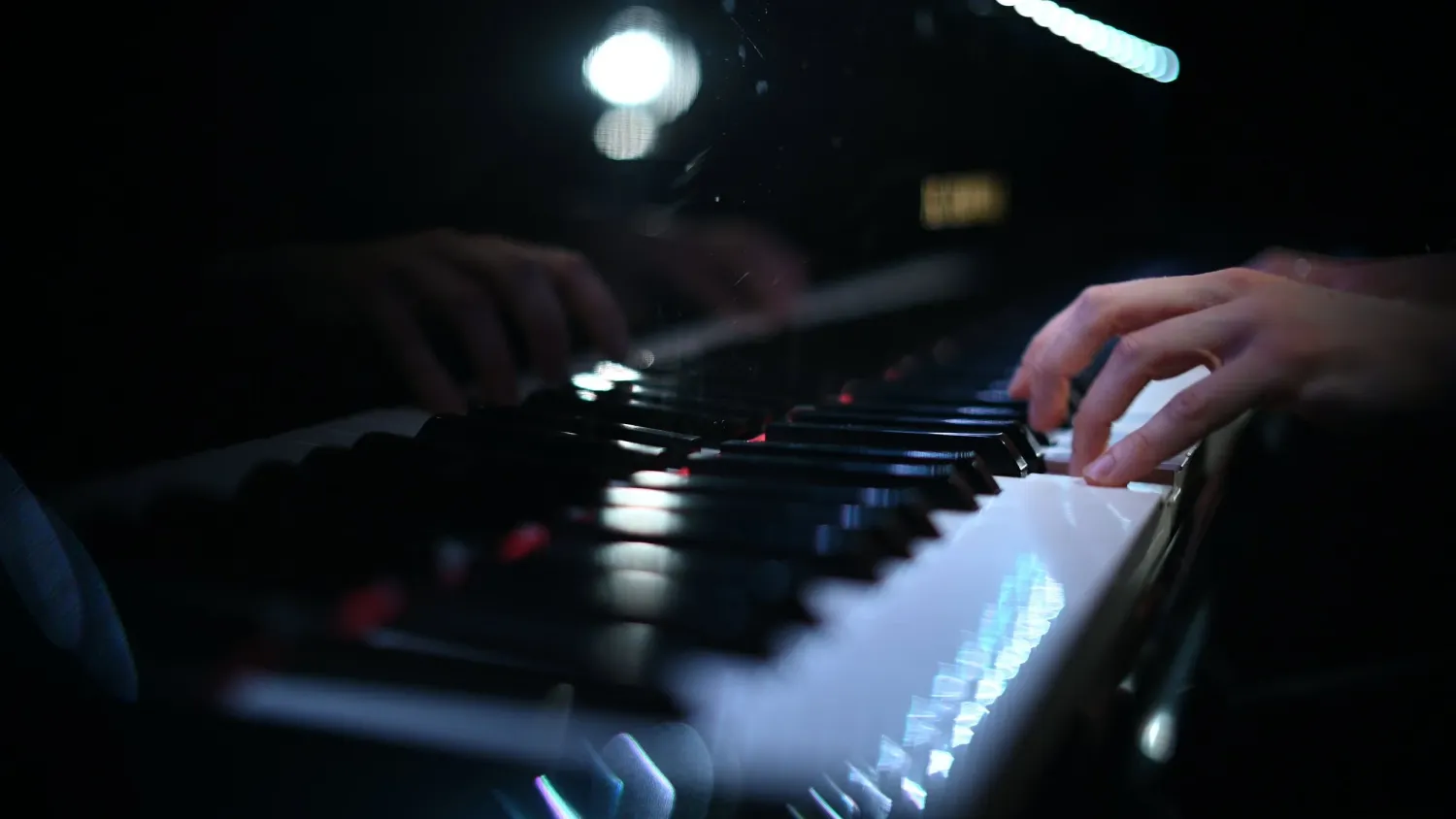 Hands at a piano keyboard