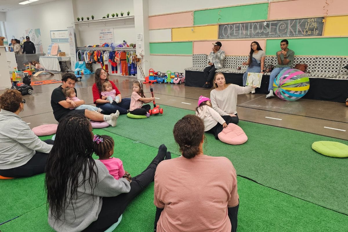 Parents and children participating in a membership play session at Kitten's Korner indoor play space