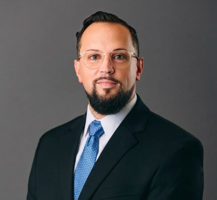 Military chefs presenting plated dishes to a senior instructor during a culinary training event