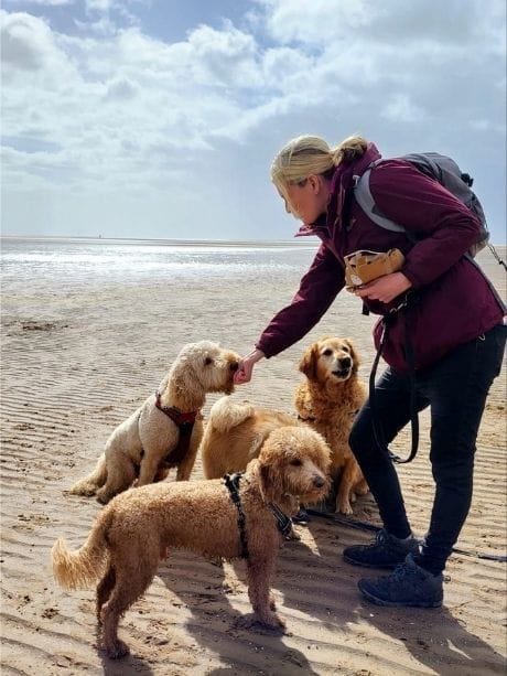 Emma on the beach on a fun day out with the dogs