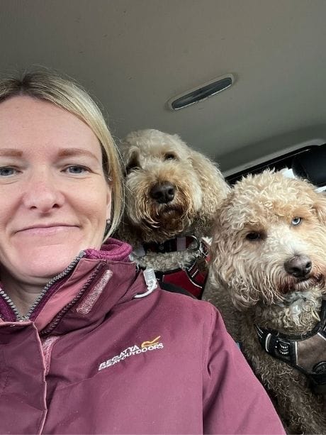 Emma with two doodle dogs