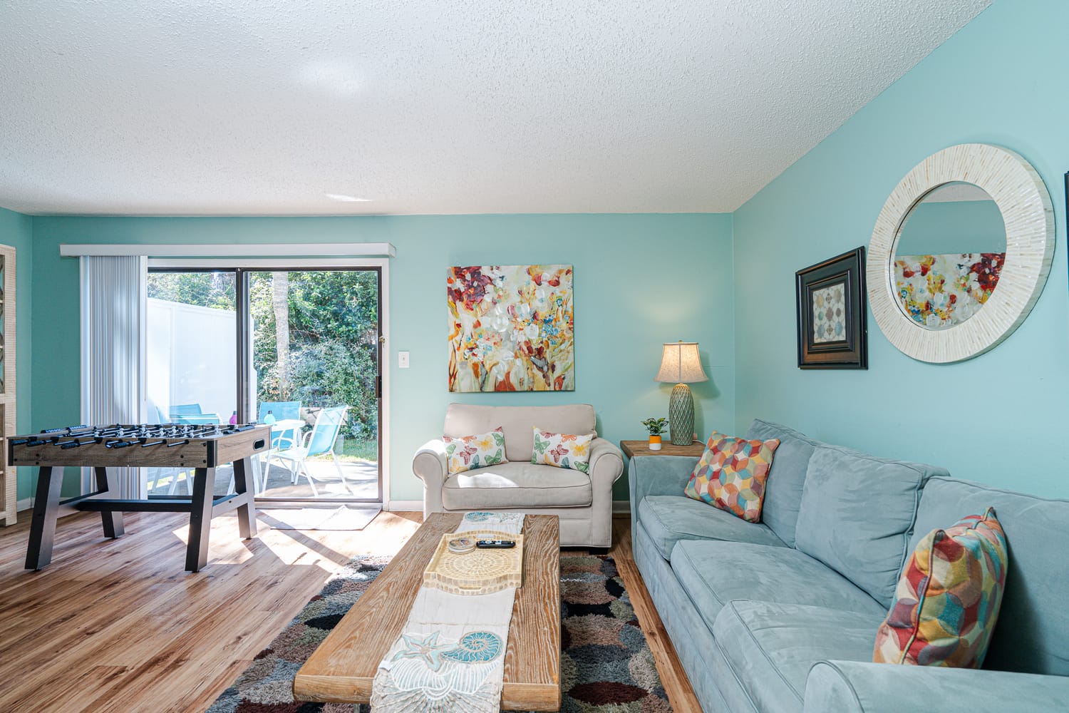 South bay by the gulf living room sofa and foosball