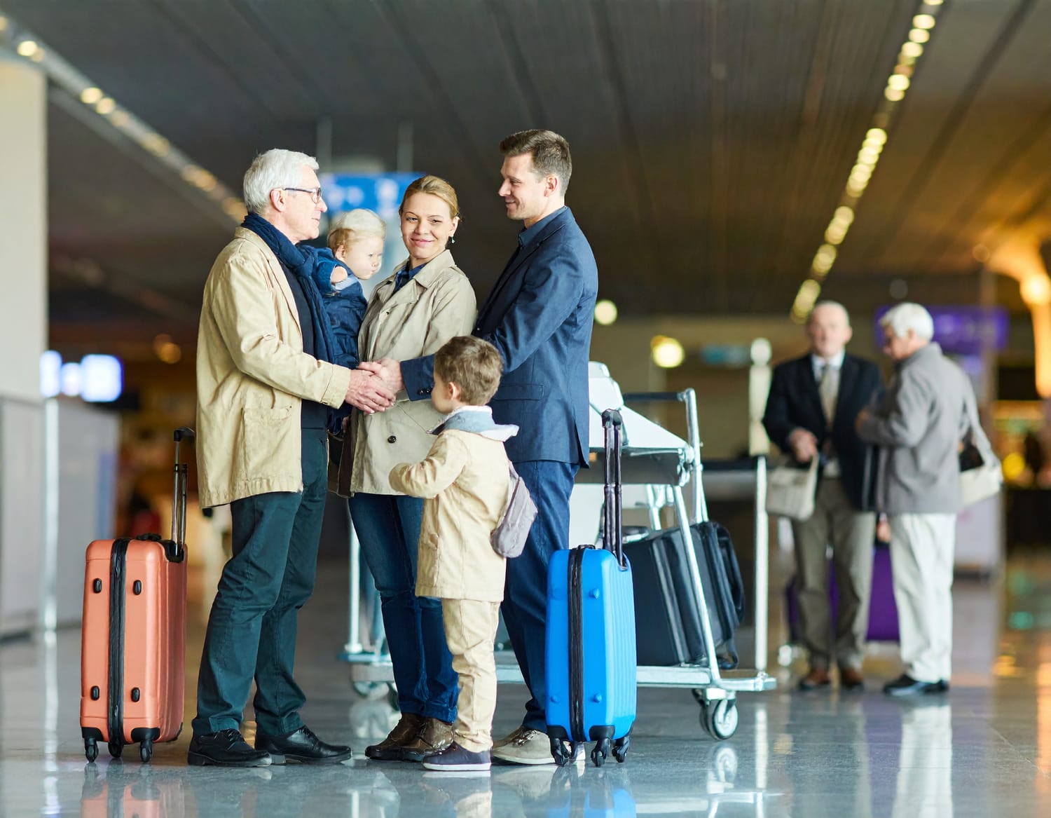 South African expat saying goodbye to elderly parents at airport