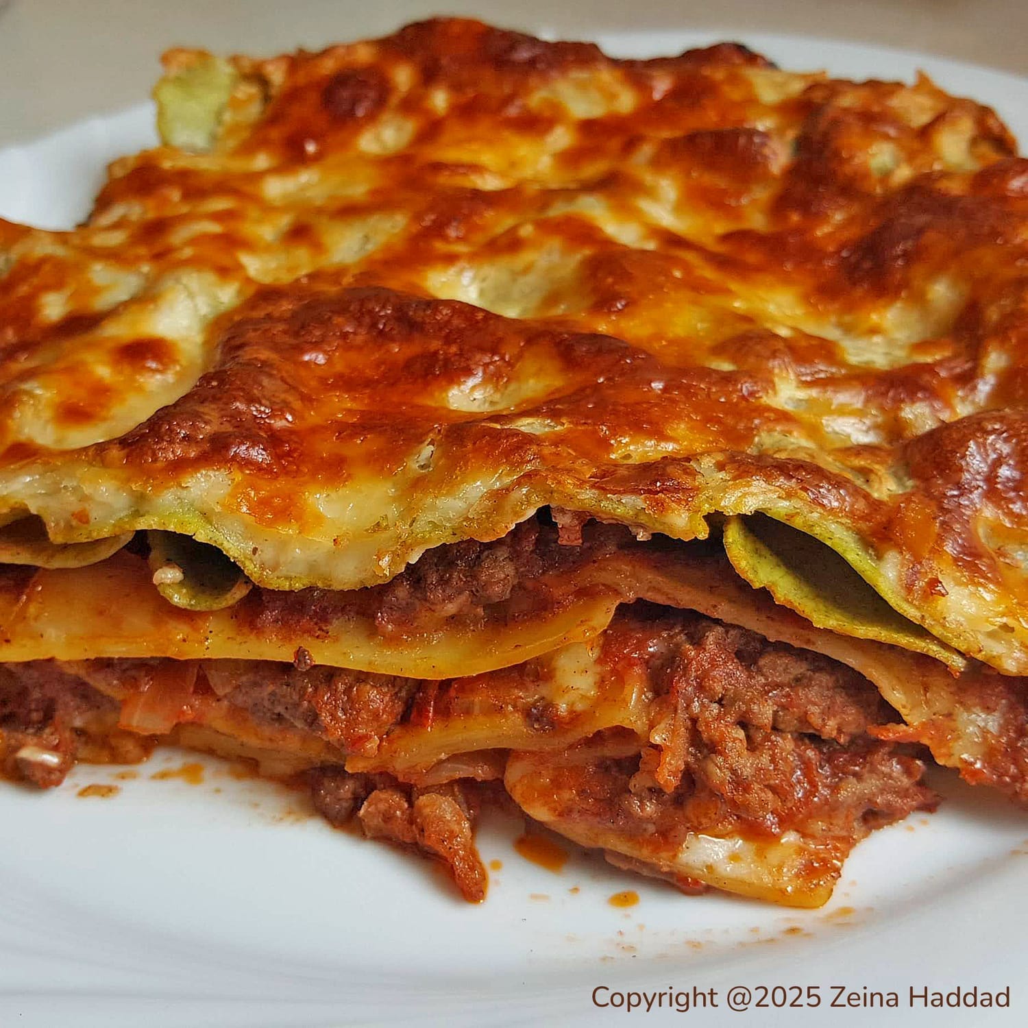Lasagna with bolognese and bechamel filling by zeina haddad