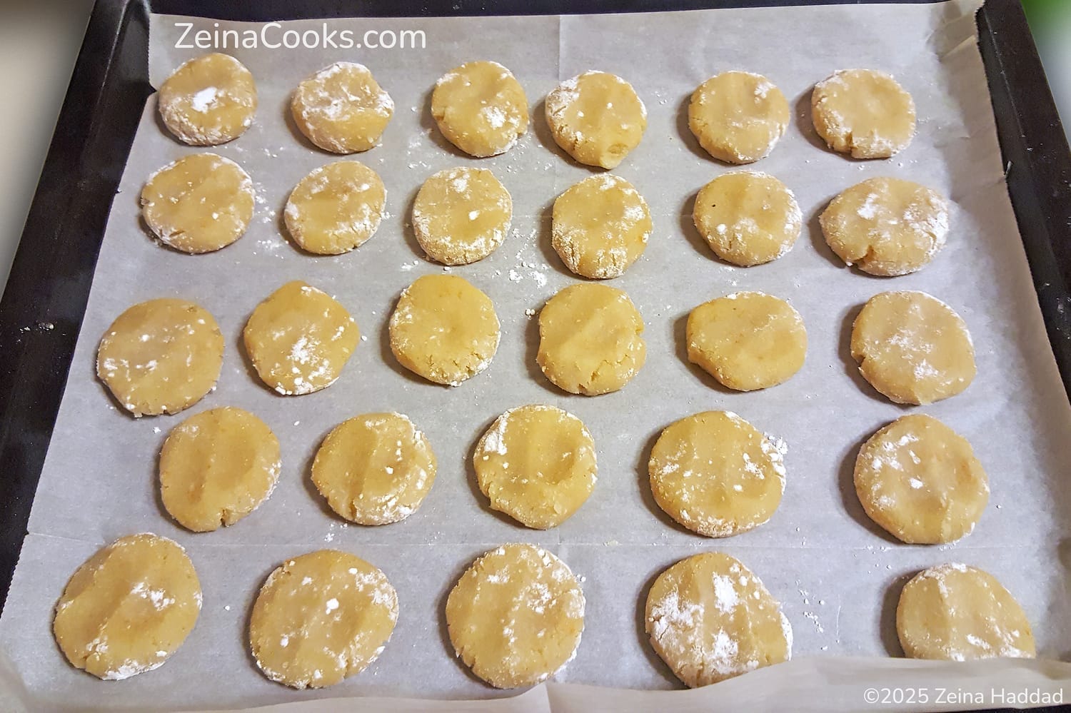 the raw amaretti cookies on a baking sheet