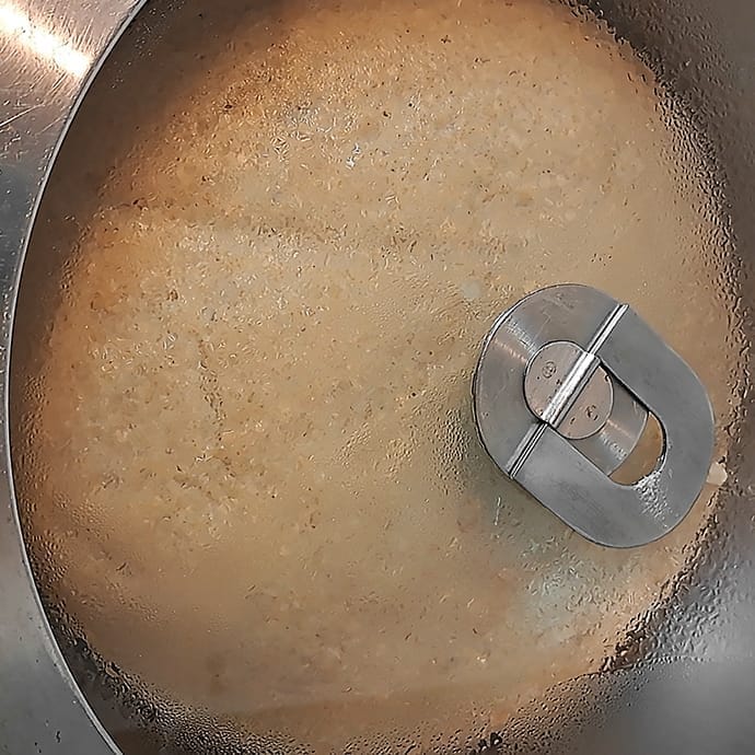 The dough for the 50/50 bread loaf gathered into a ball and placed in an oiled bowl and covered, fully risen and doubled in size, by ZeinaCooks.com.