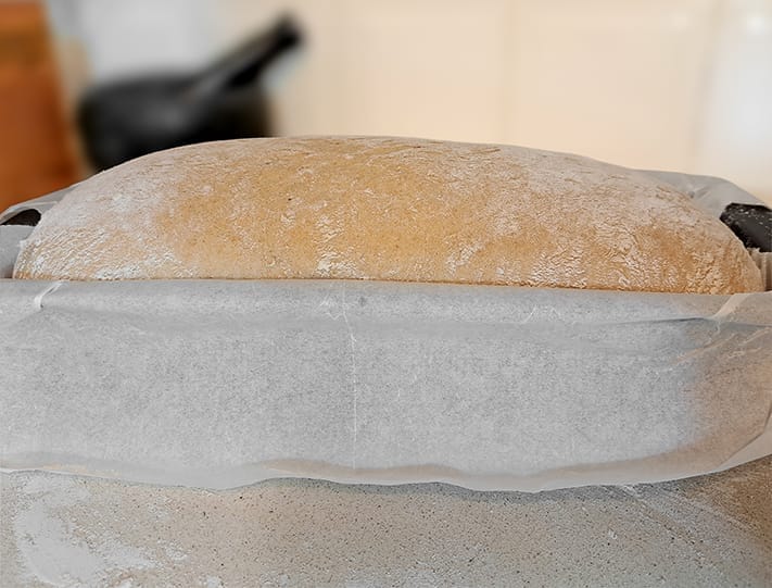 The dough for the 50/50 bread loaf. proofed in the loaf pan and ready for baking, by ZeinaCooks.com.