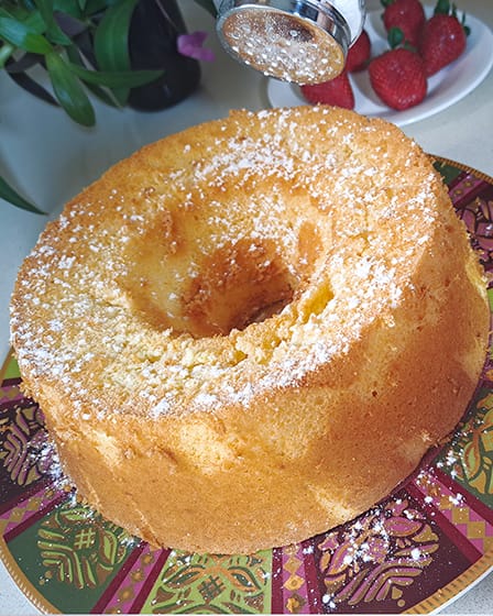 dusting the cake with powdered sugar