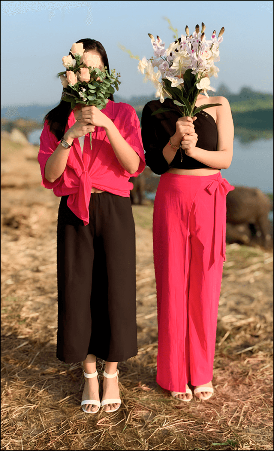 Love and Ella covering their faces with flowers