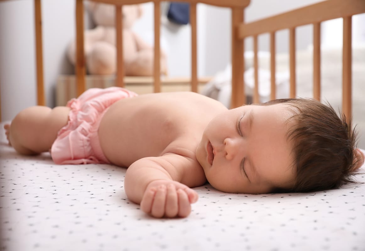 Baby sleeping in crib