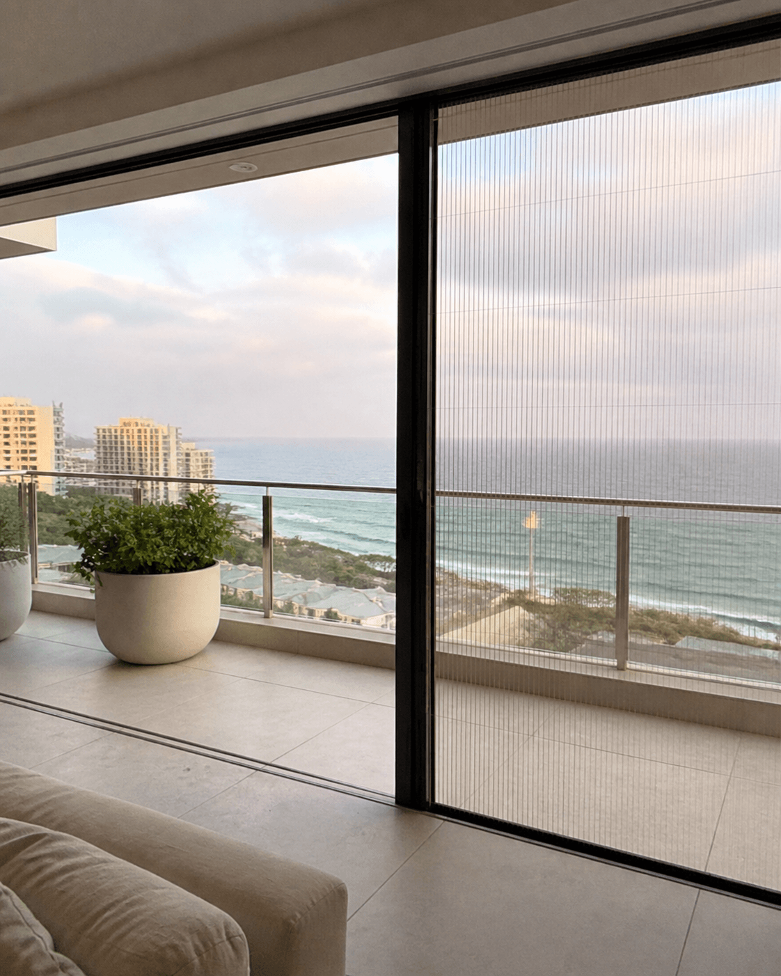 Modern Durban home with installed insect screen doors Open living space with sliding insect screens and natural airflow Indoor-outdoor home setup with insect screen protection Contemporary home featuring custom insect screen systems