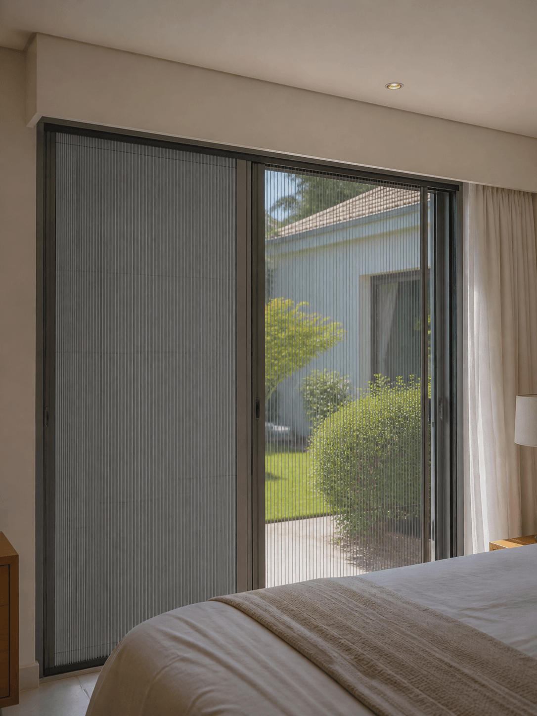2-in-1 insect screen and blockout system installed in bedroom Dual-function insect screen with privacy blockout feature Bedroom window fitted with 2-in-1 screen system Durban Combined insect protection and blockout blind installation Modern home interior with 2-in-1 insect screen solution