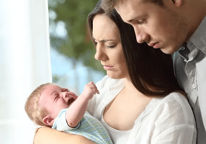 Pediatric assessment of a newborn in Kids Health Journey Clinic with doctor face not visible.