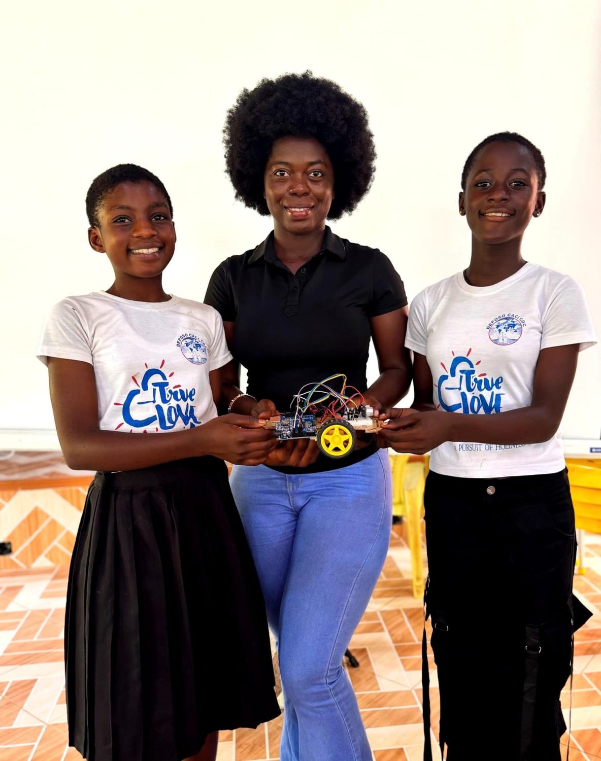 Girls taking part in a robotics and technology learning activity