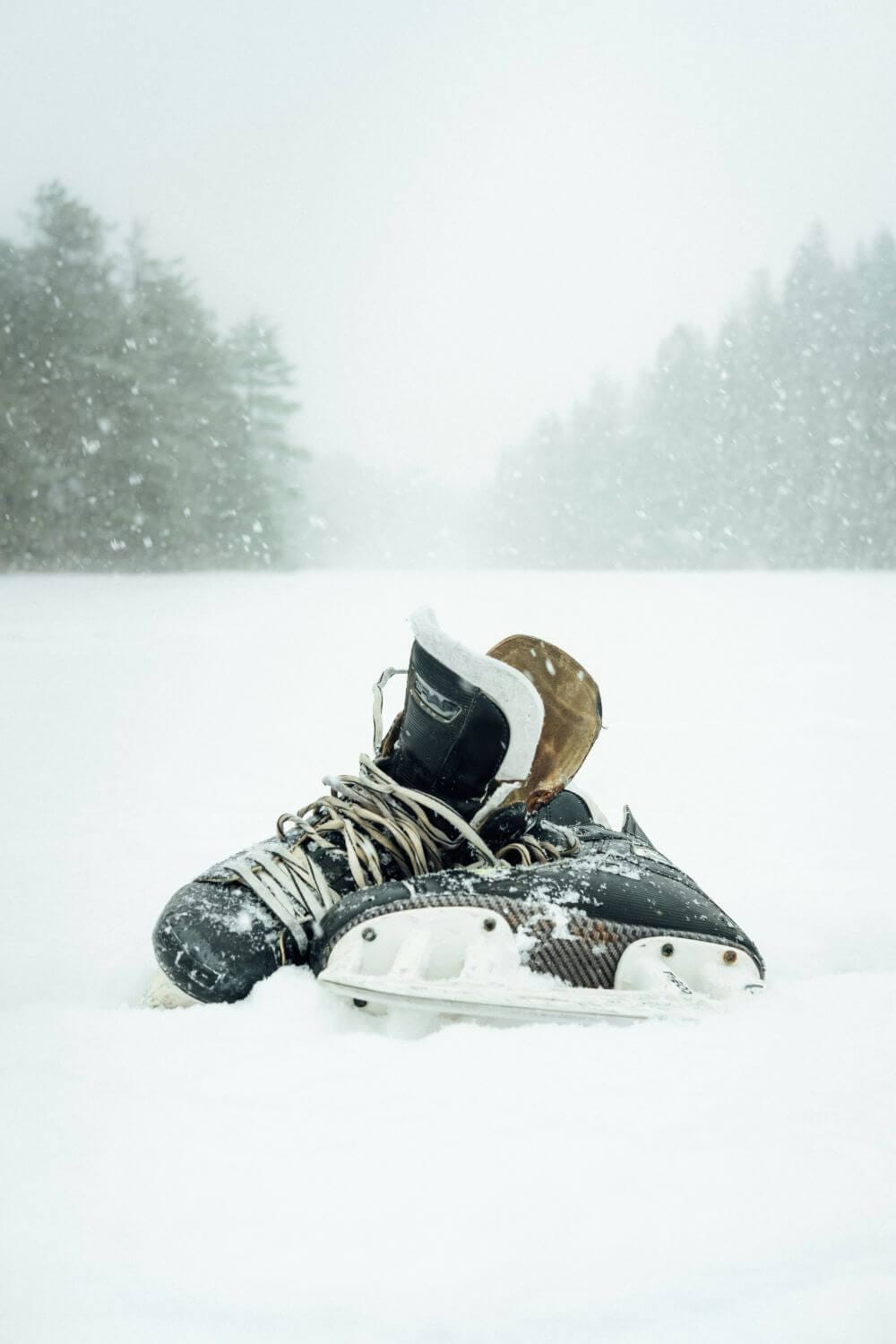 image of hockey skates in the snow