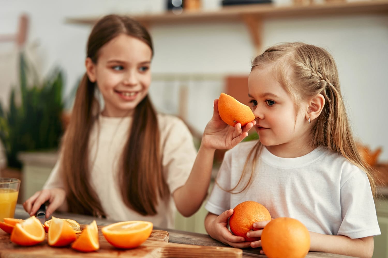 Man giving Reiki to a pregnant woman who is lying on a massage table