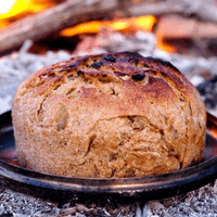 Freshly baked sourdough camp bread by Van Africa during a 4x4 overlanding adventure.