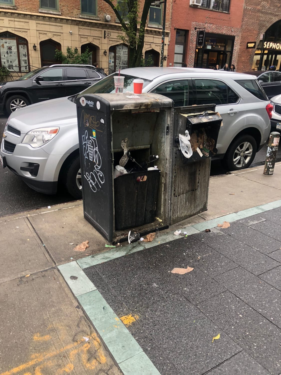 trash overflowing on city street