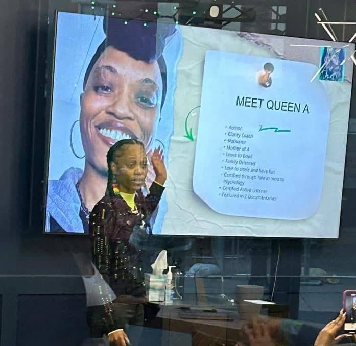 Queen A presenting to an audience