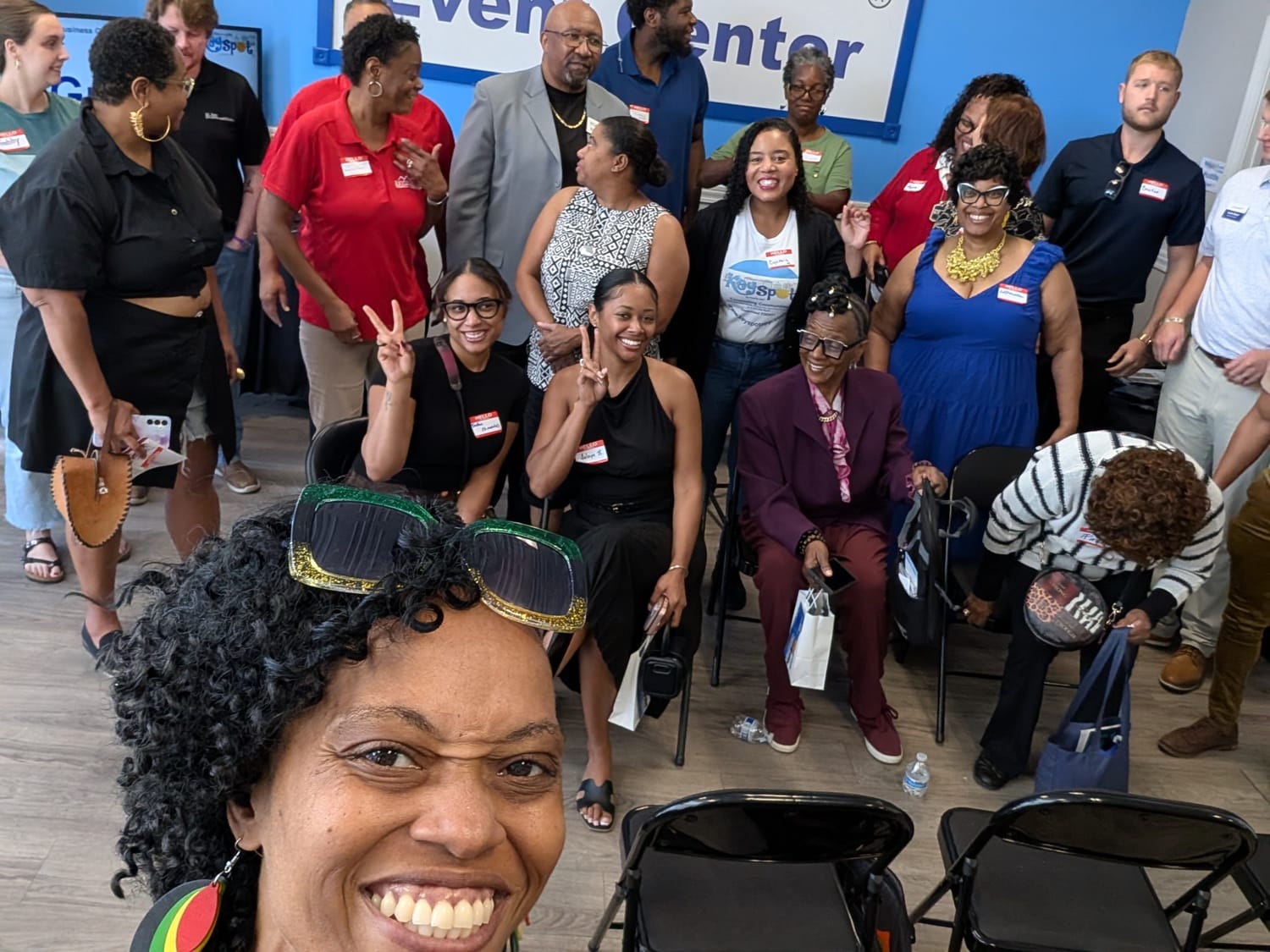 Queen A with community members at an event
