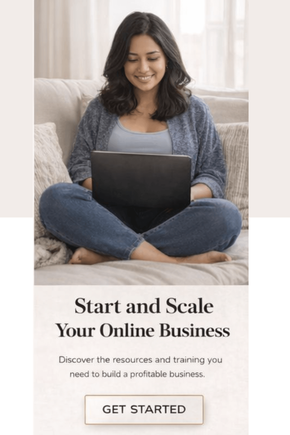 female entrepreneur sitting on couch looking at laptop