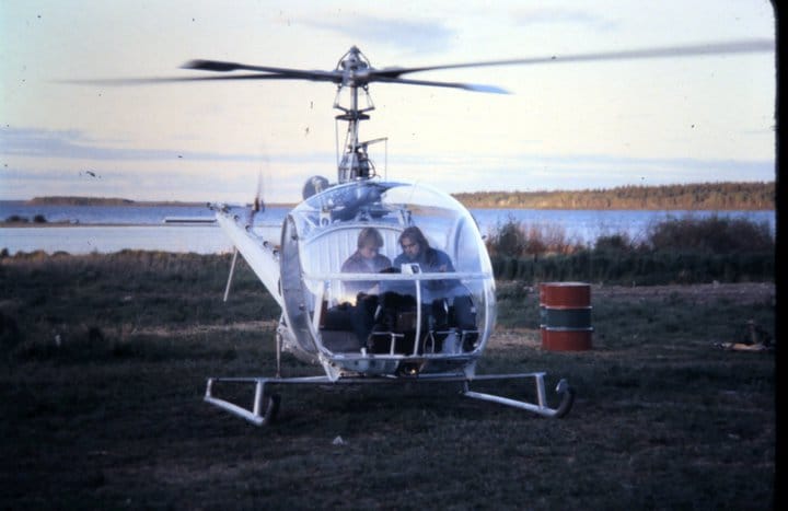 A young Eric Pittman sitting in the cockpit of the first helicopter he built from wreckage in Buffalo Narrows, ready for its first season of flight.