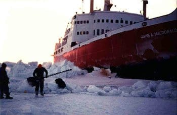 The Coast Guard icebreaker John A. MacDonald moored in the frozen ocean, where Eric Pittman first served as a navigator and witness to the natural world.