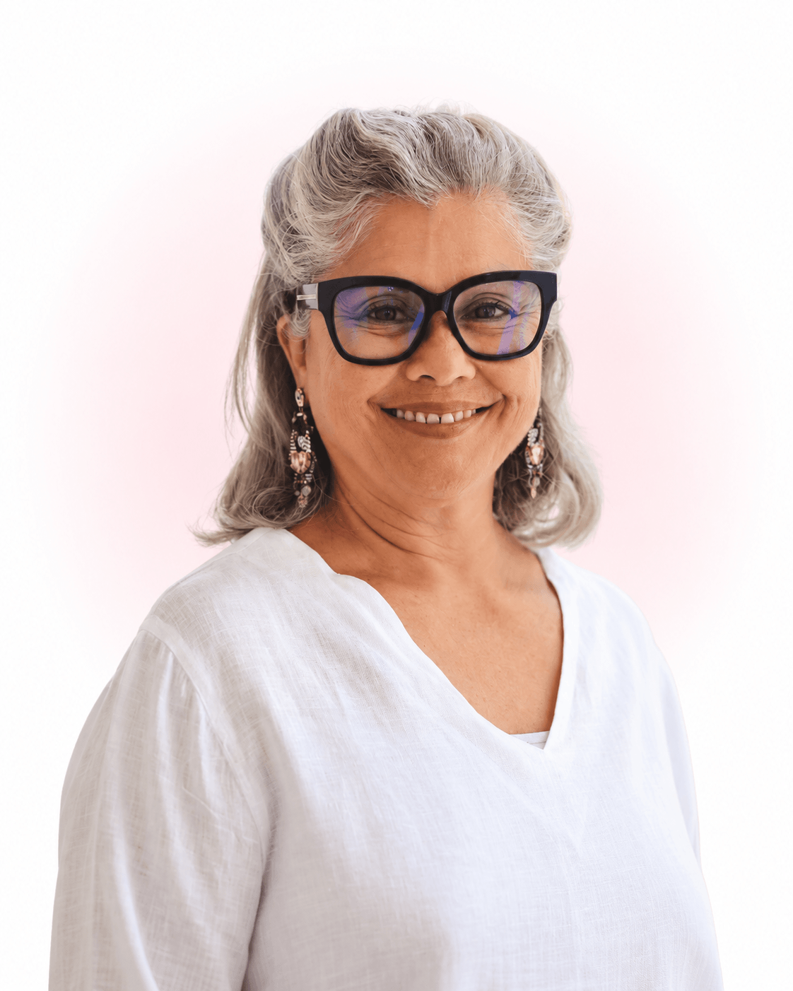 Candace Castro smiling, wearing glasses and a white blouse.