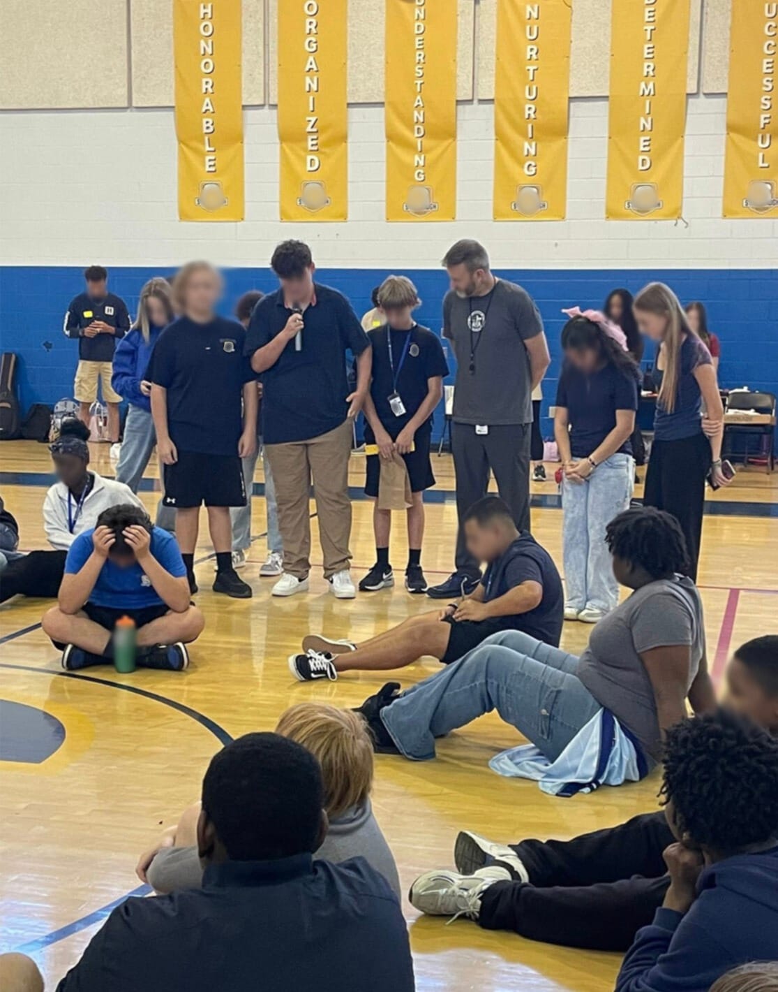 FCA praying with students