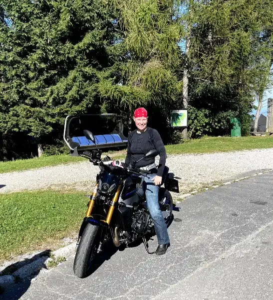 PK on her motorcycle at a rest stop in the Slovenian mountains, living the motorcycle mystic philosophy on the road
