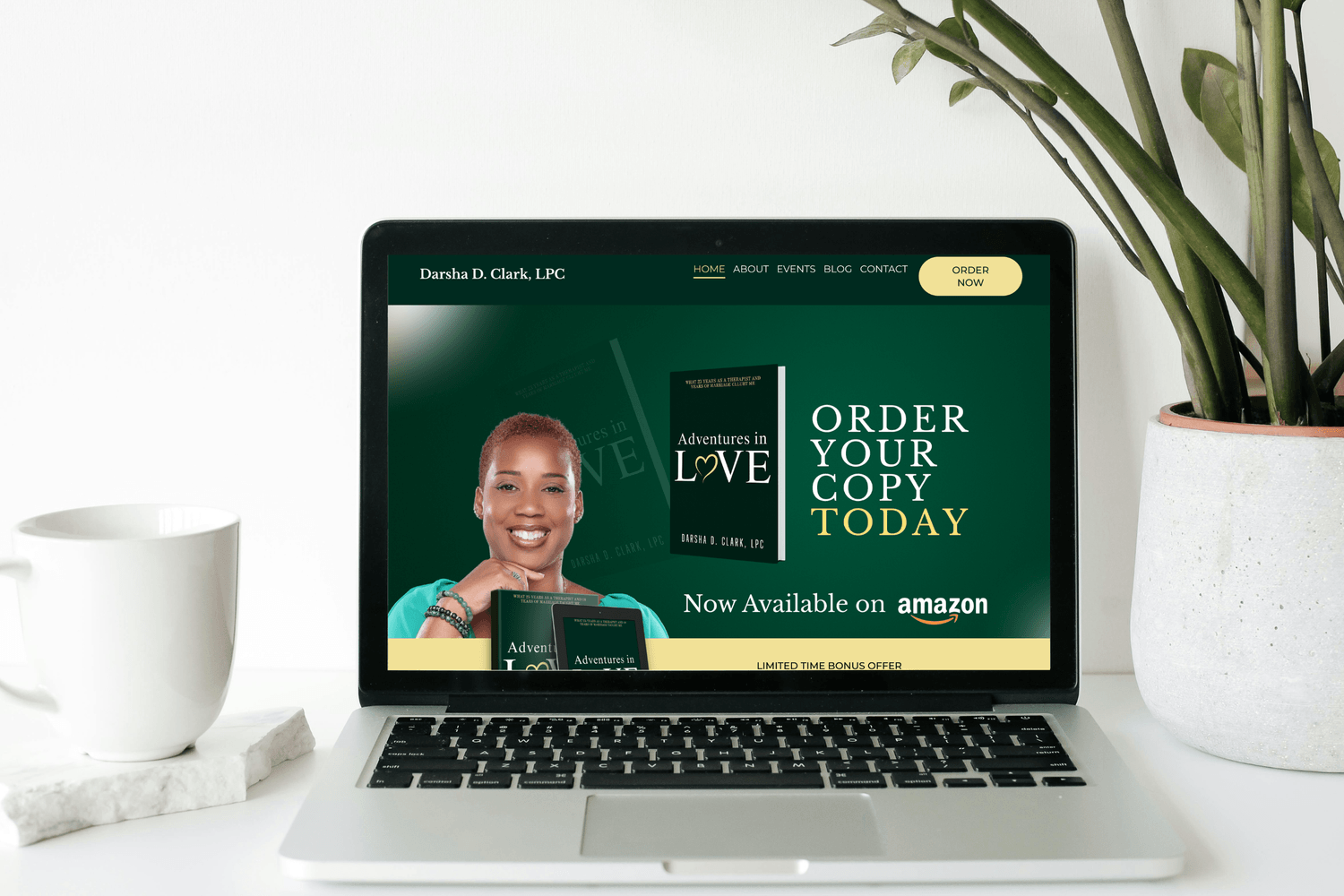 Image of laptop showing Darsha D. Clark Author Website