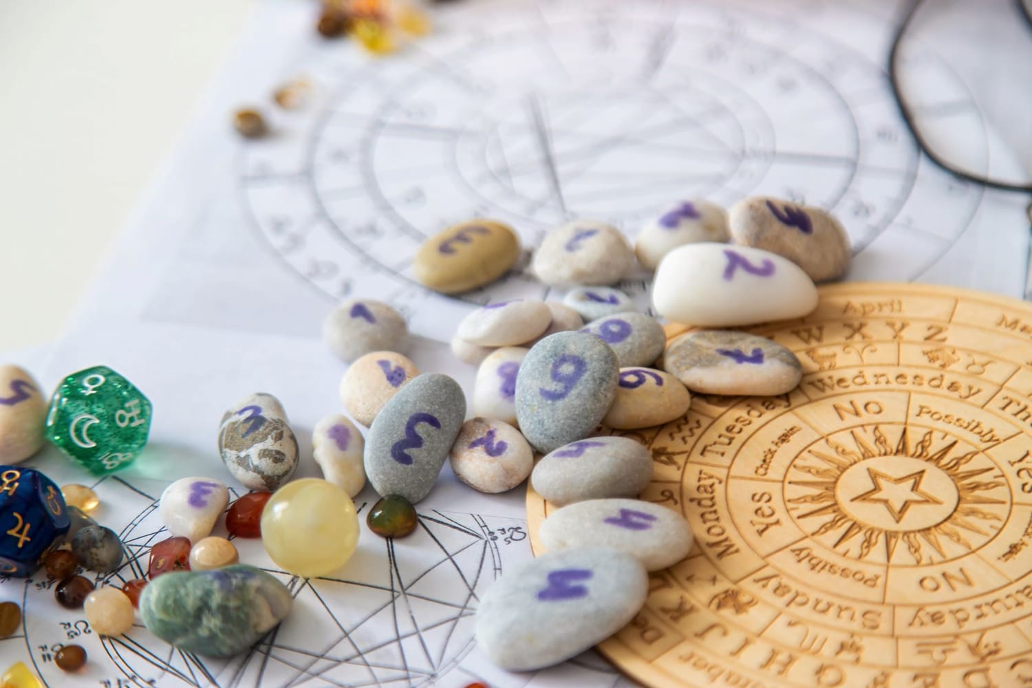 Numerology stones with numbers on a wooden zodiac board