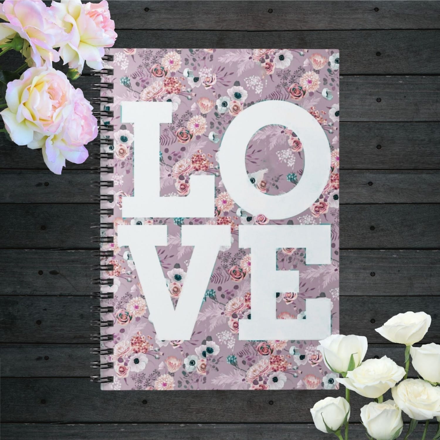 Spiral notebook with a pink floral cover with the word LOVE 