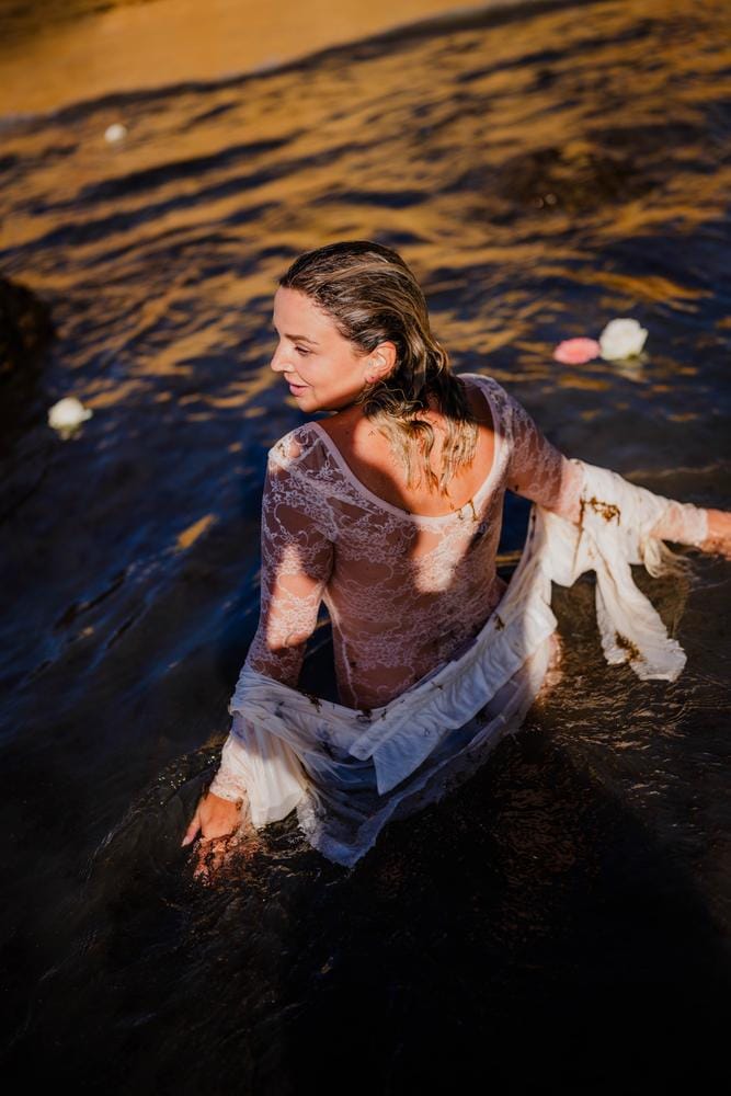 Valérie in the water, looking back over her shoulder