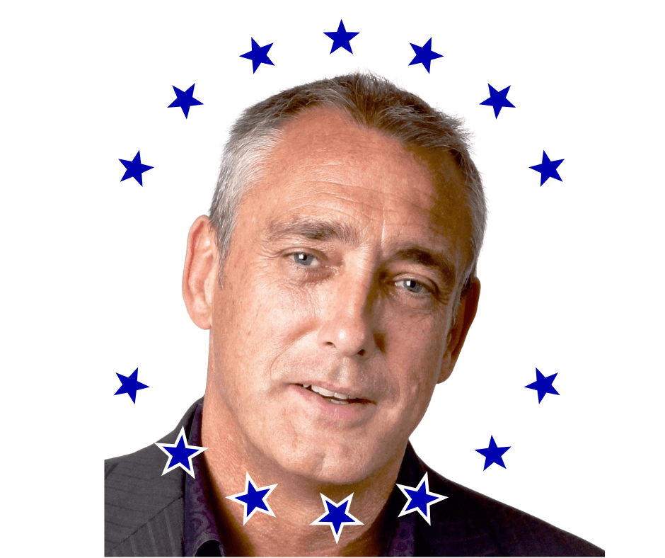 Professional portrait of Ash Lawrence, experienced British entrepreneur with short grey hair, confident expression and direct gaze, set against a light background with a circle of blue stars. Founder of ABC Networks and Amazon bestselling author known as #FlipFlopPsycho, specializing in business, performance psychology, solar energy, and property development.