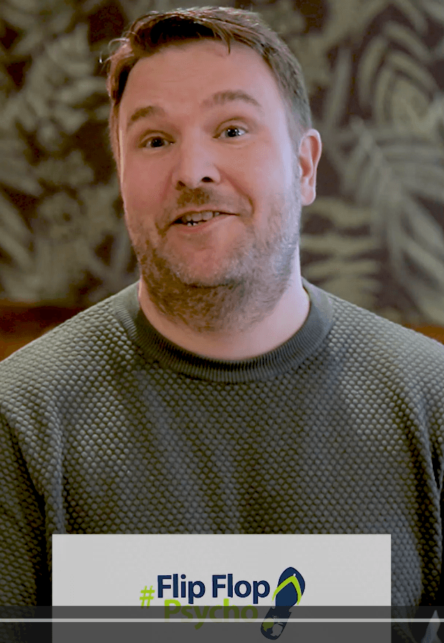 Roland Stanley, Property Entrepreneur, speaking on camera with FlipFlopPsycho branding, sharing testimonial