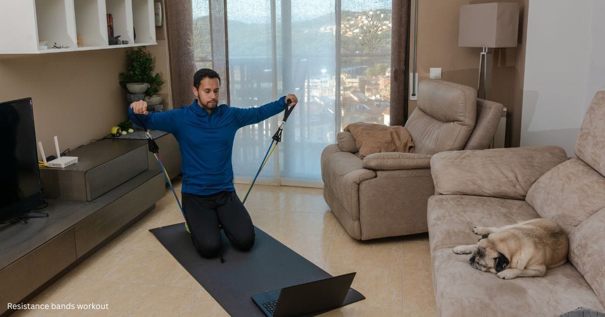 A man doing lateral raises with resistance bands.
