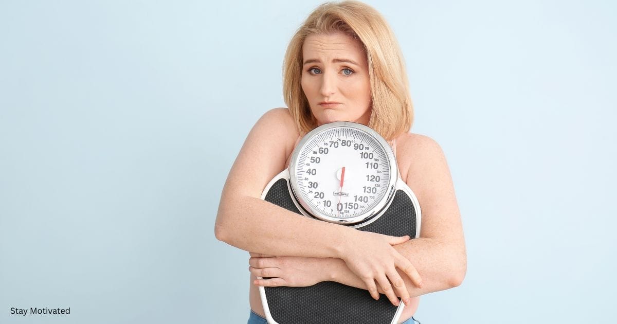 A woman holding a scale