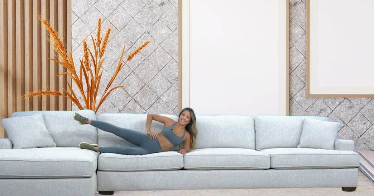 A woman doing thigh raise exercises on her couch