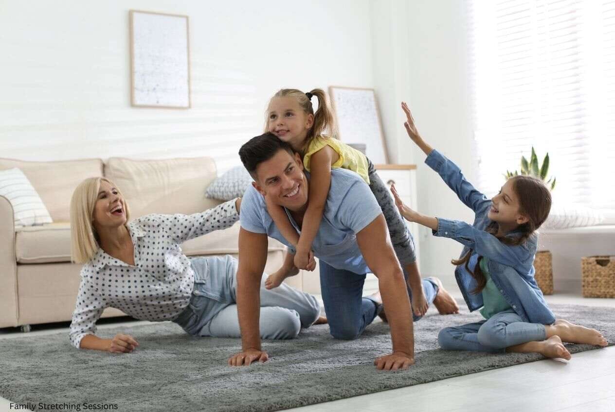 A happy family smiling while stretching and dancing together in a bright living room.