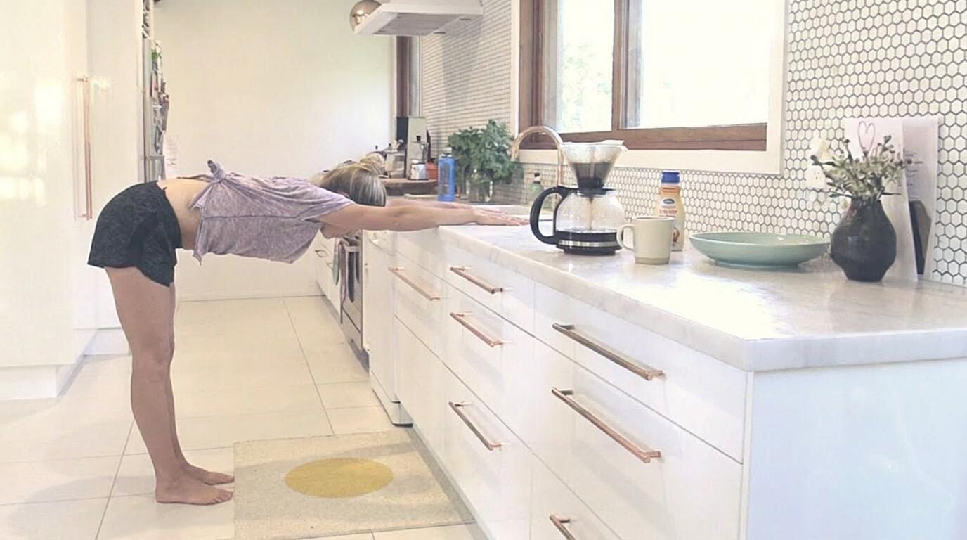 A woman doing an incline chest stretch