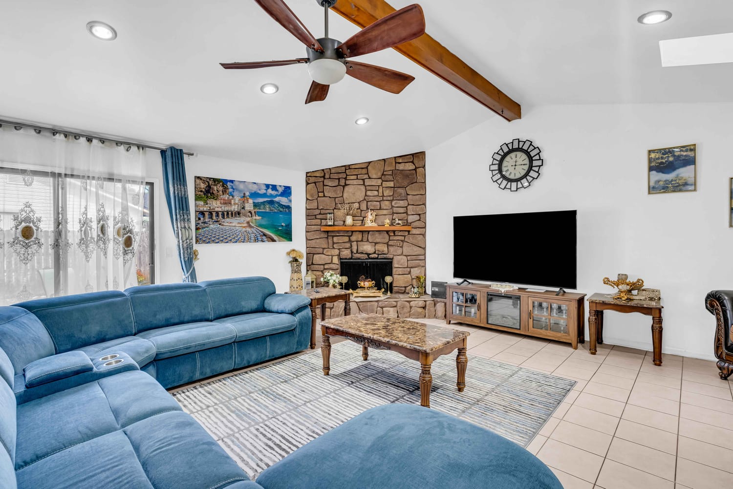 Wide-angle shot of a versatile loft area or game room in a two-story residential home.