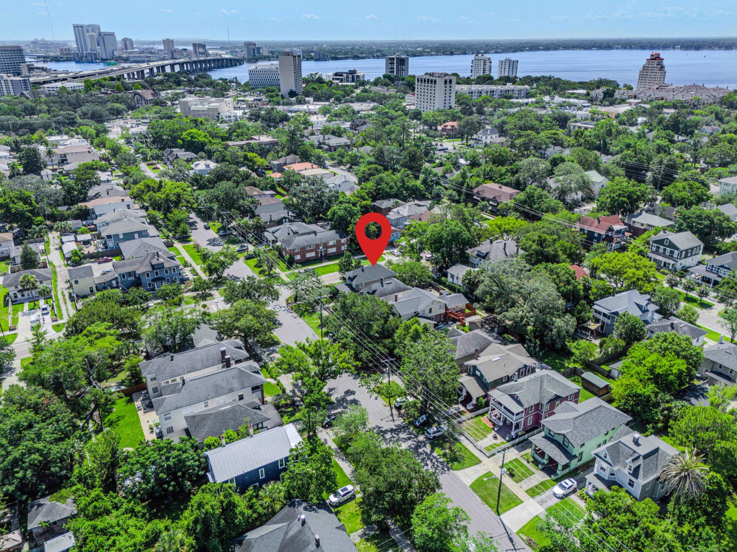 Aerial drone view of a residential neighborhood pin in Jacksonville, FL, showcasing property layouts and local community infrastructure.