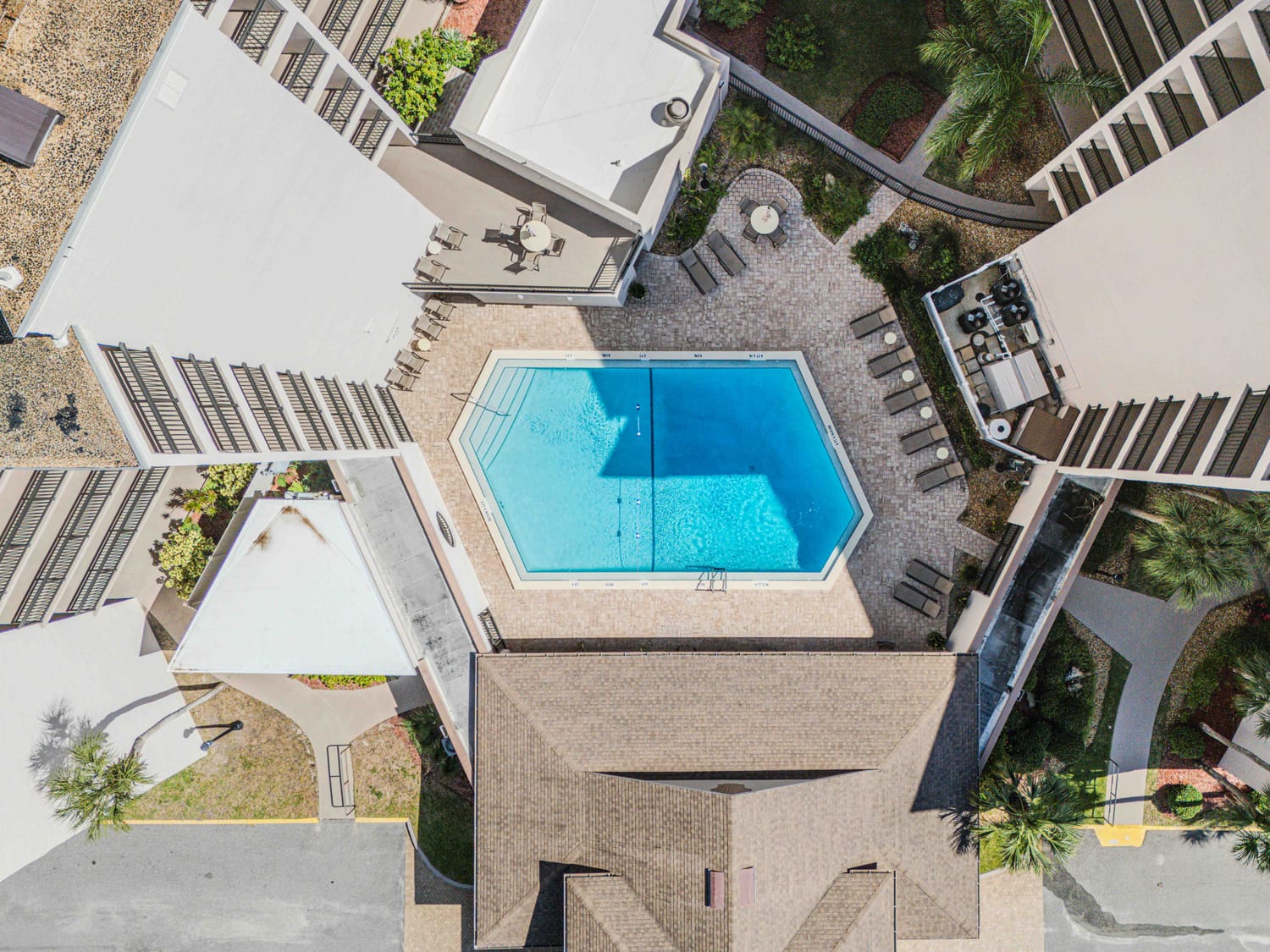 Drone photography pin of a luxury amenity center and pool area in a St. Johns County gated community, perfect for lifestyle marketing.