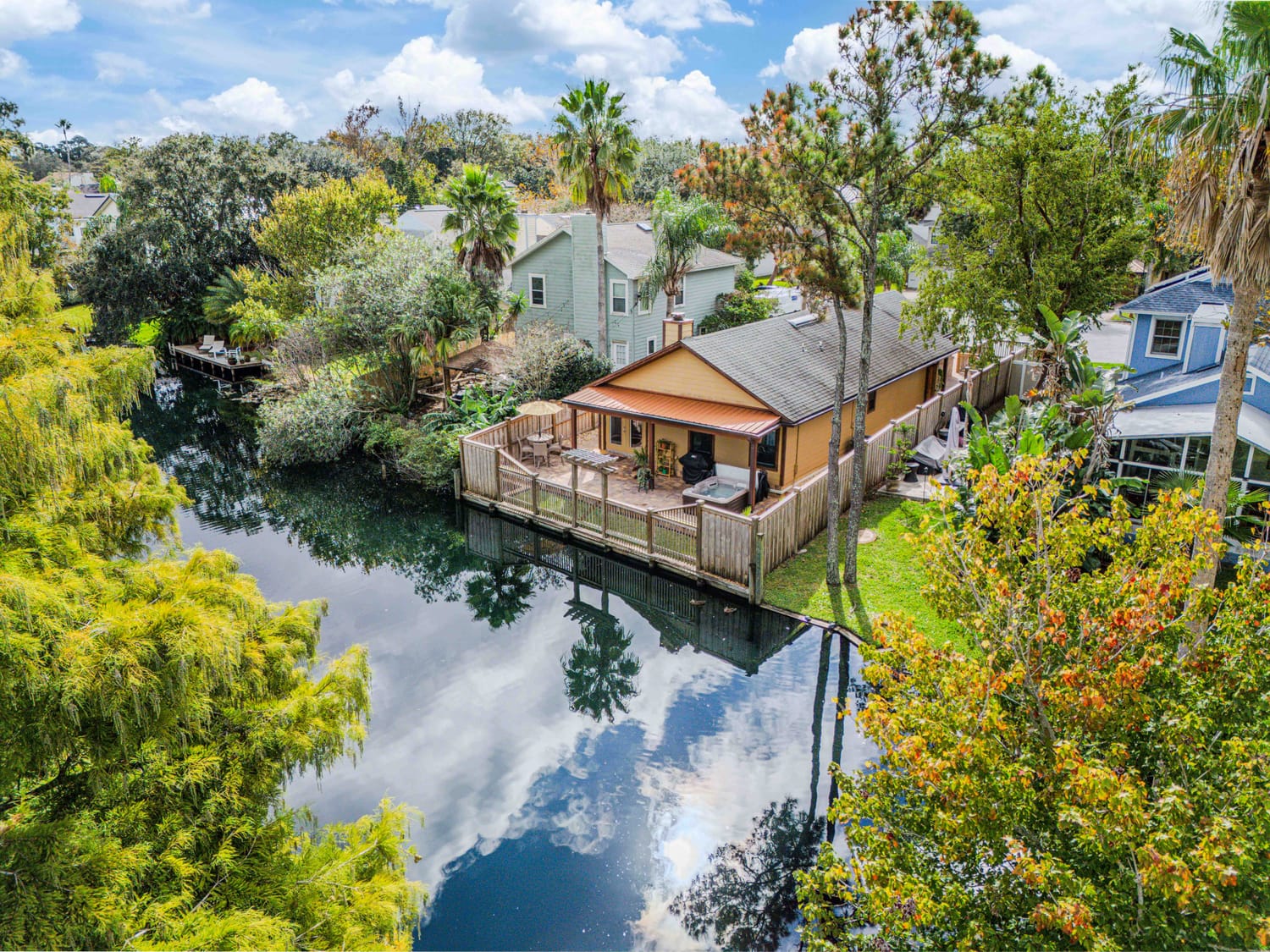 High-altitude drone photography of a luxury waterfront home pinned in Saint Augustine, highlighting the proximity to the Intracoastal Waterway.