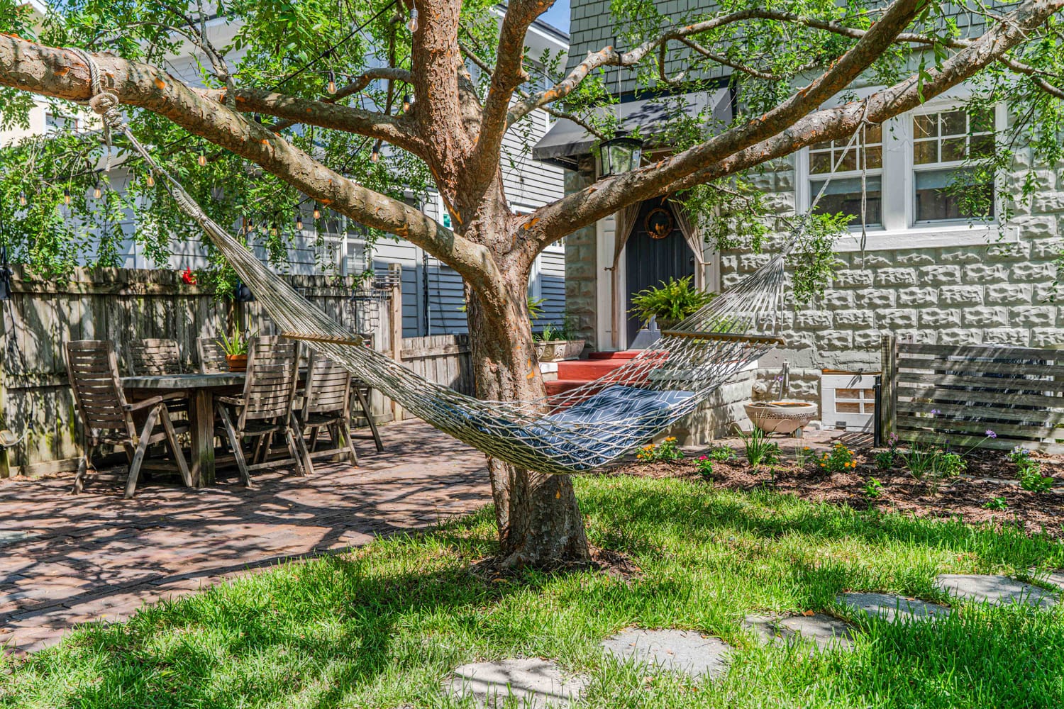Aerial view of a luxury resort-style community pool pinned in Saint Augustine, FL, featuring professional lounge seating and tropical landscaping