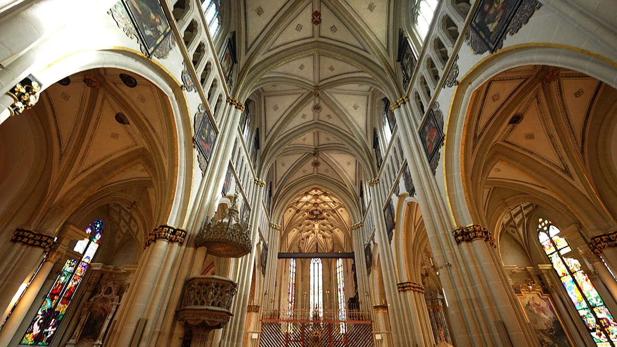 Interior of a large cathedral with tall arches and long natural reverb. This image illustrates how different spaces create depth and ambience in a mix.