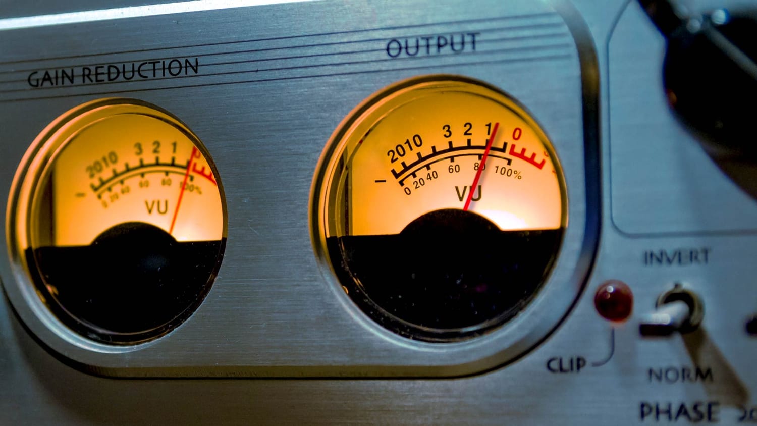 Close-up of a compressor's meters used for audio processing.